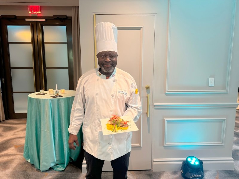 Chef David Nvodjo showcases his new sea bass at Le Meridien Madison’s Sep. 10 event. Some of the other new menu items include crab cakes and roasted okra. (Anthony Tilghman/The Washington Informer)