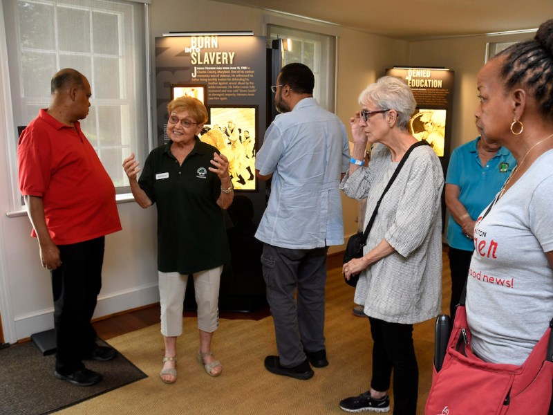 Bernice Bernstein shares historical facts with participants of the Washington Informer Charities' African American Heritage Tour at the Josiah Henson Museum. (Robert R. Roberts/The Washington Informer)