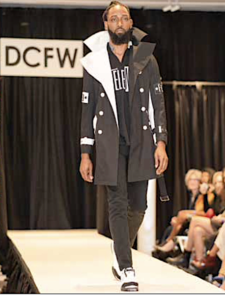 A model walks down a runway at a fashion show. (Courtesy of Harry Crosland)