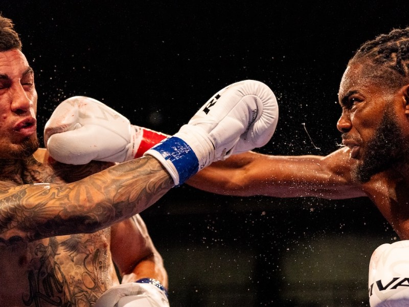 Winner Jordan White (right) and Jason Sanchez throw punches at each other during the title fight held at the Entertainment and Sports Arena in Washington, D.C., on Aug. 3. (Marcus Relacion/The Washington Informer)