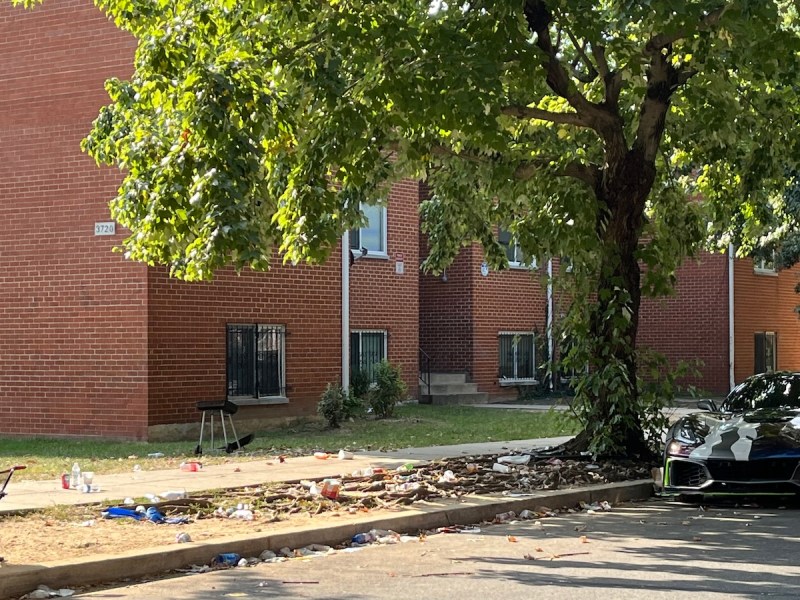 Trash outside of an apartment building in Southeast D.C. (D.R. Barnes/The Washington Informer)