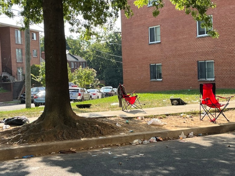 Portable chairs and on the lawn of an apartment building in Southeast D.C. (D.R. Barnes/The Washington Informer)