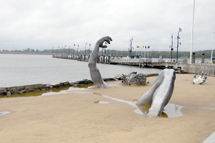 Tropical Storm Debby led to days of increased precipitation that caused flooding in some parts of Maryland. Near The Awakening statue in National Harbor, some residual waters remained even after the rains calmed. (Anthony Tilghman/The Washington Informer)