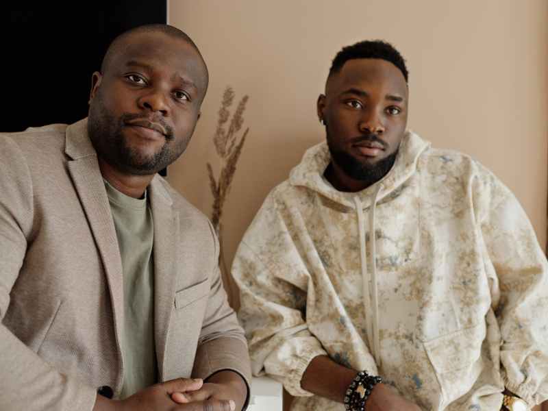 two men posing and looking at the camera