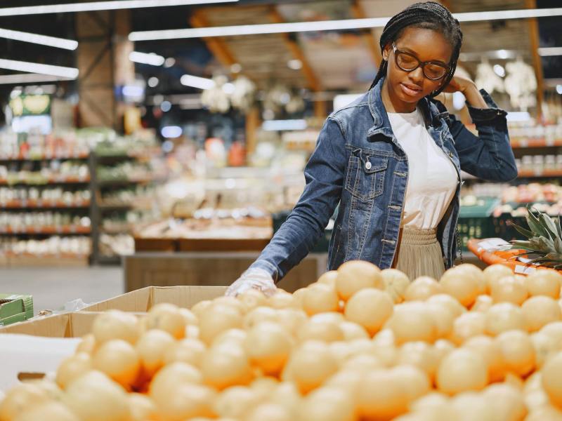 a woman shopping in a grocery store