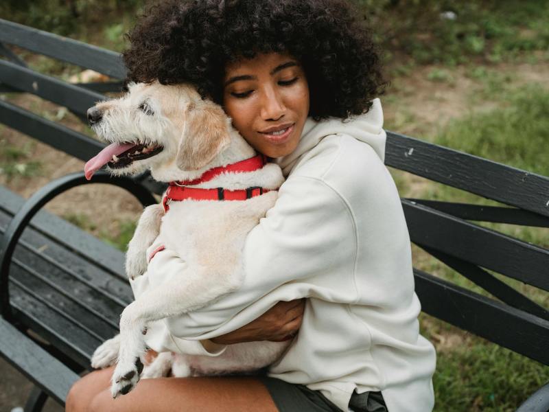 woman hugging her dog