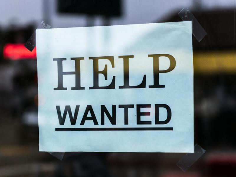 help wanted sign on glass