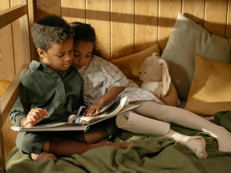 two kids reading a fairy tale book